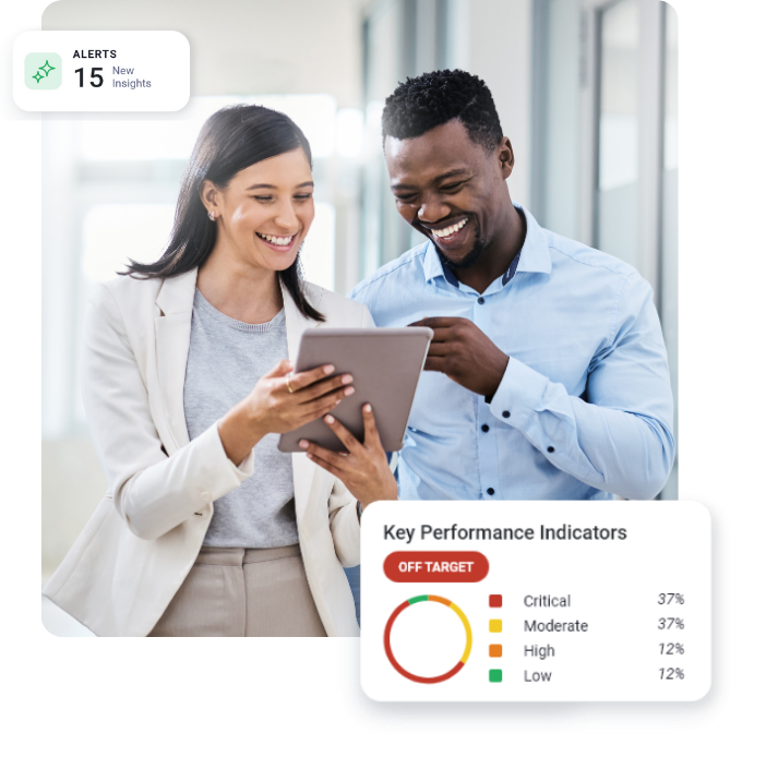 Two colleagues collaborating on a project, looking at tablet screen.