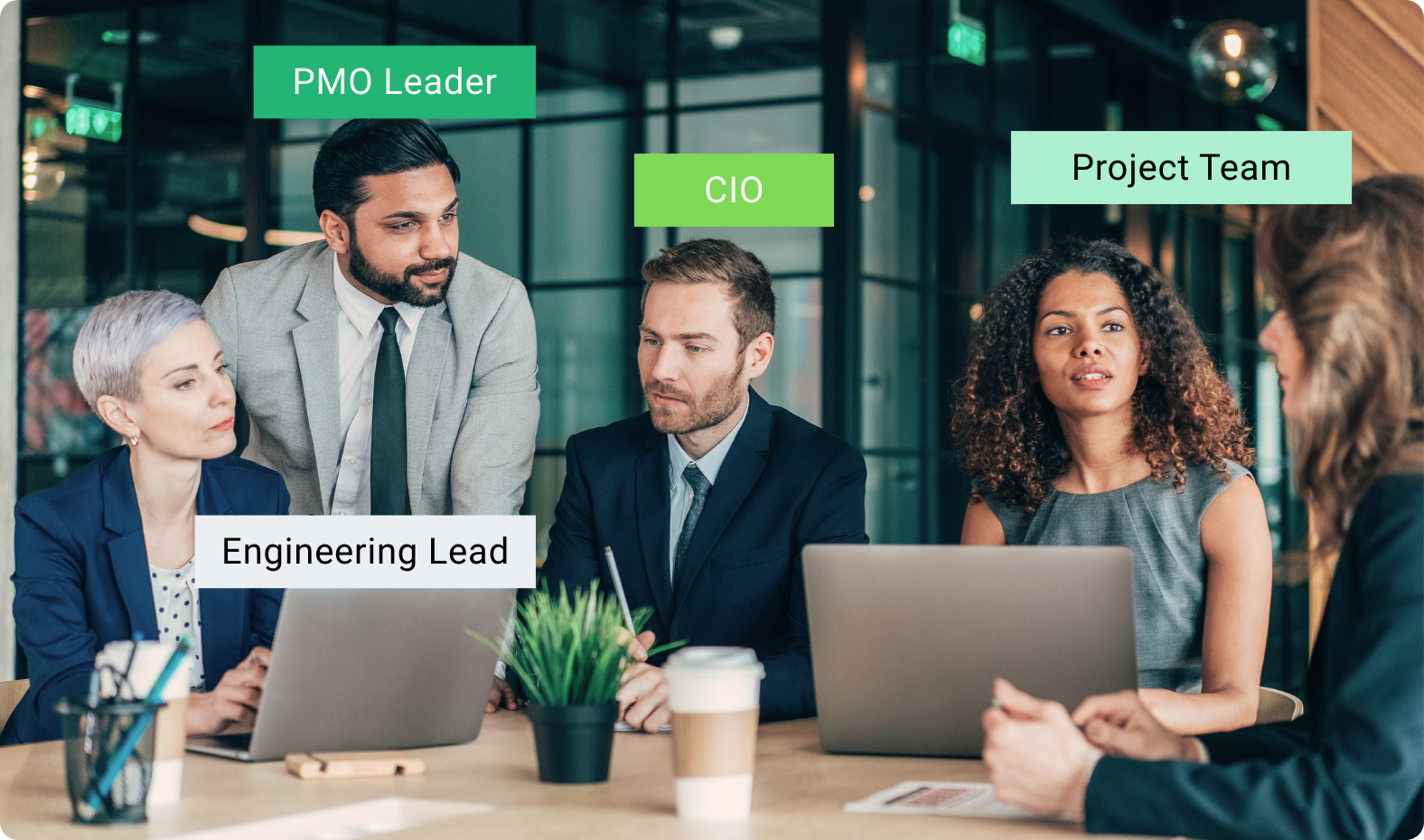 Group of professionals sitting together in a workplace setting.