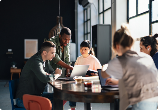 Group of professionals sitting together in a workplace setting.