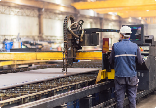 Two colleagues in a manufacturing setting.