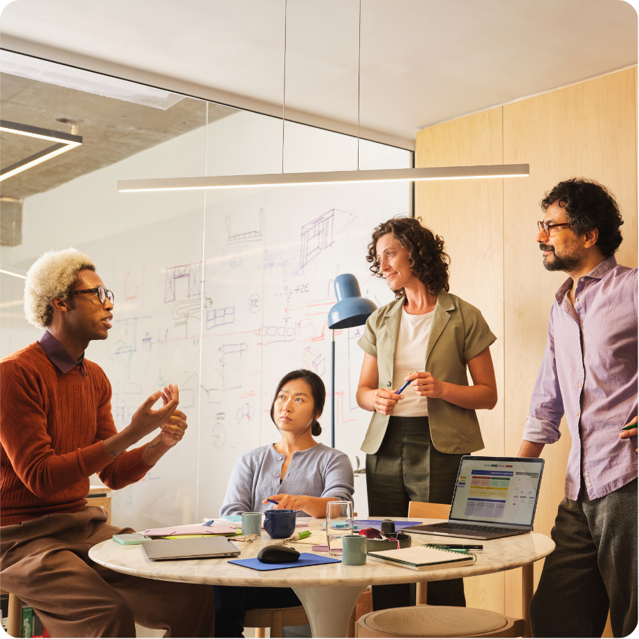 Group of professionals sitting together in a workplace setting.