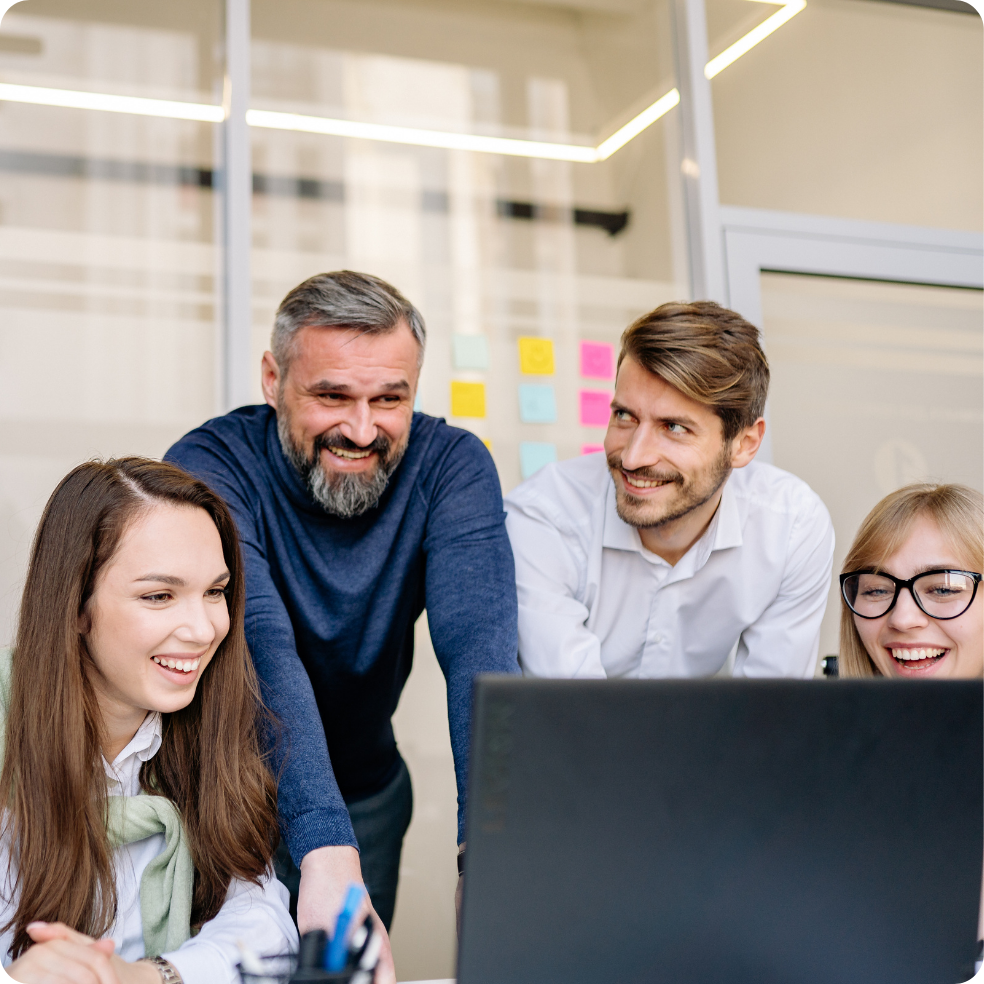 Group of professionals sitting together in a workplace setting.