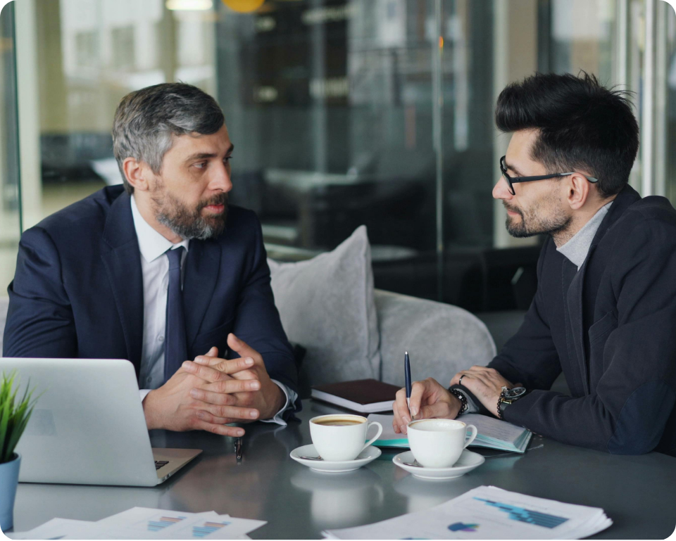 Customer success representative interviewing customer.