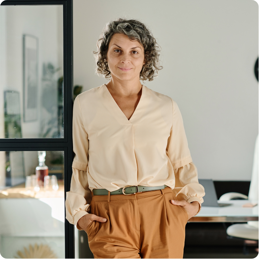 Professional standing in office setting.