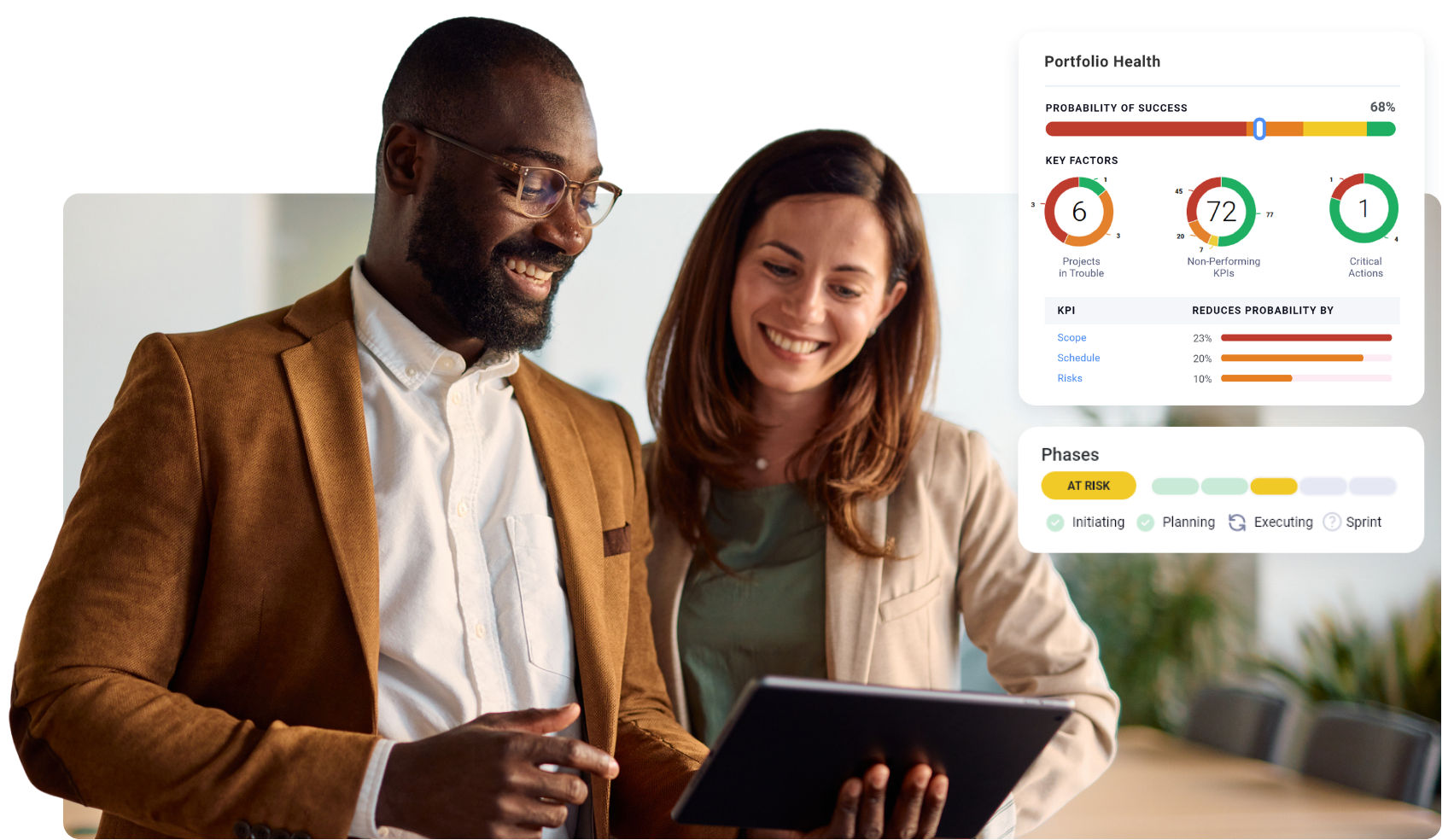 Two colleagues collaborating on a project, looking at tablet screen.