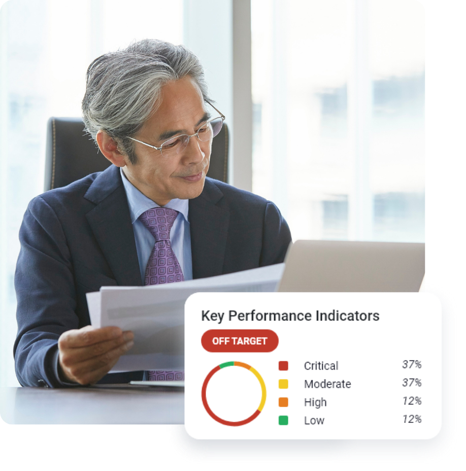 Professional working on a laptop at a desk.