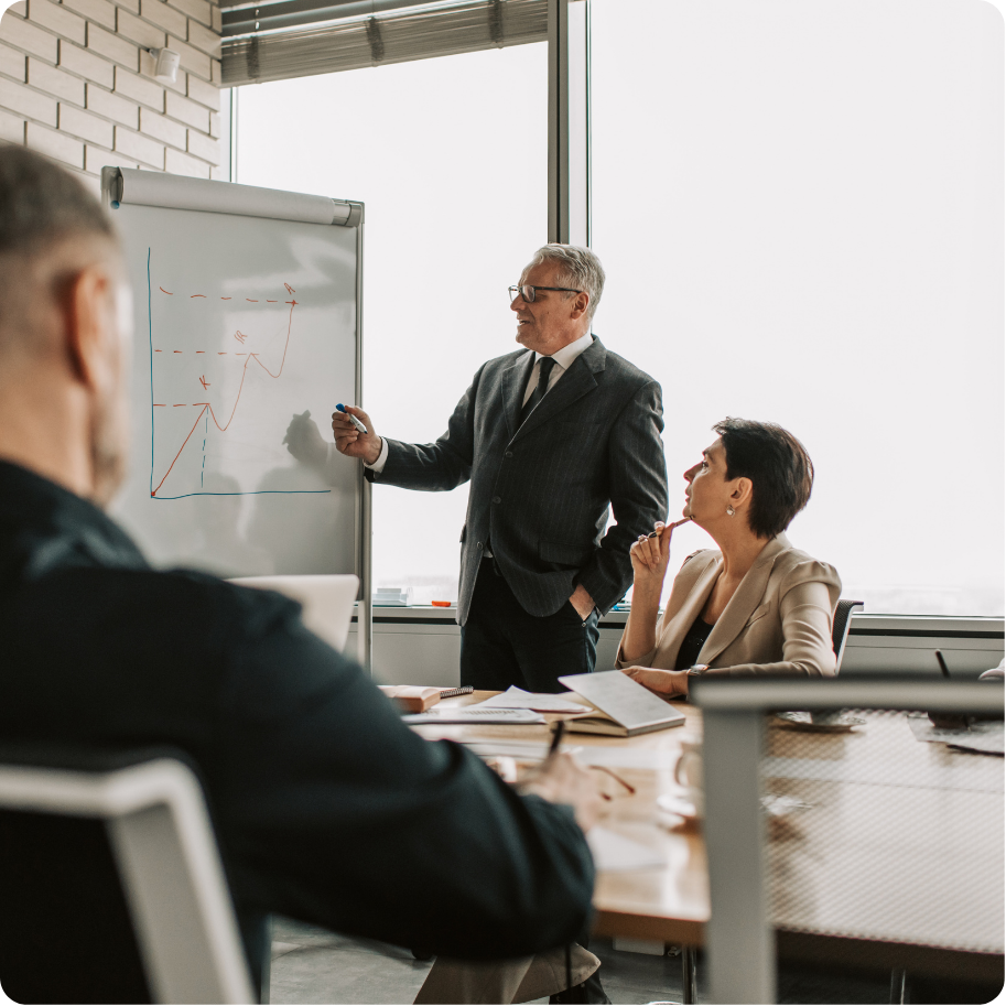 Group of professionals sitting together in a workplace setting.