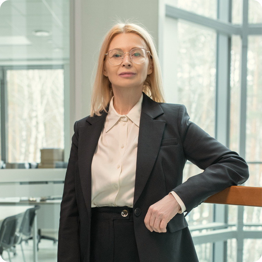 Professional standing in office setting.