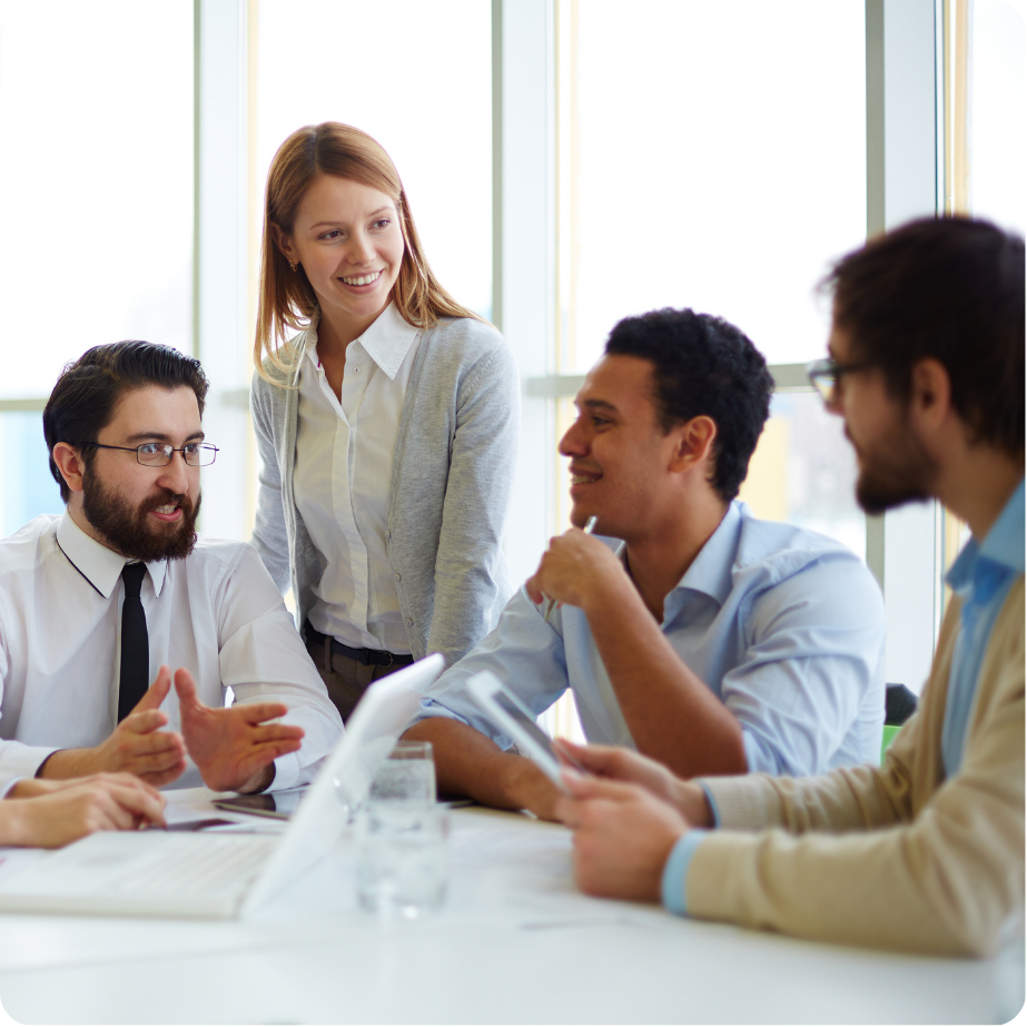 Group of professionals sitting together in a workplace setting.