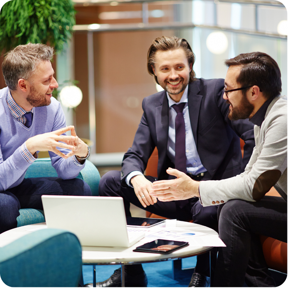 Group of professionals sitting together in a workplace setting.